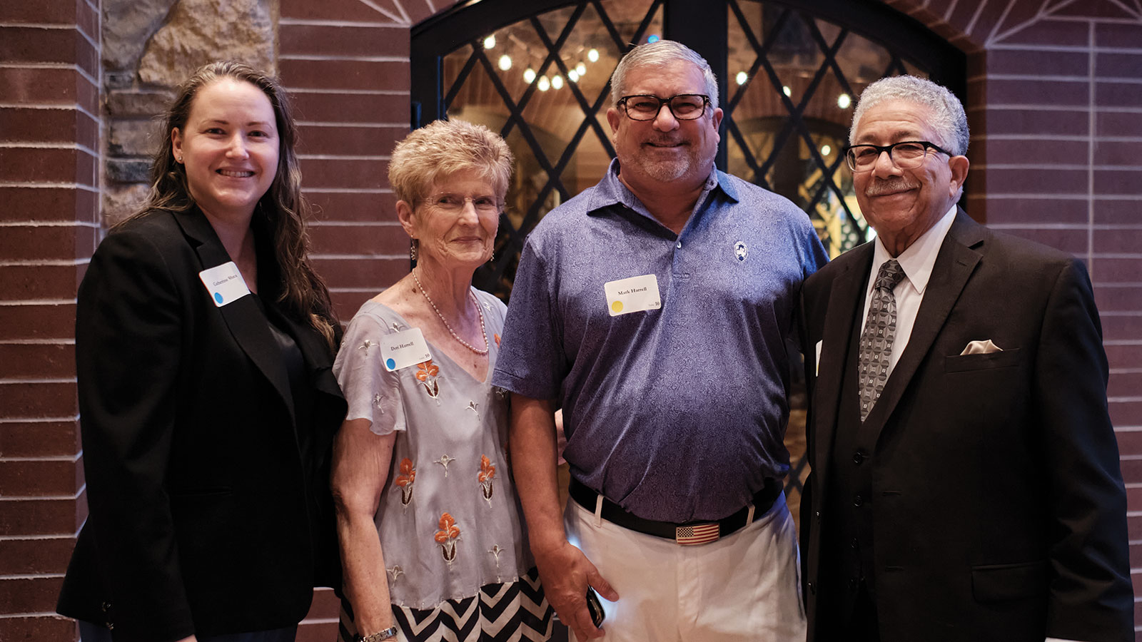 Catherine Shea, Dori Harrell, and Mark Harrell join Judge Alfred Harrell for a photo
