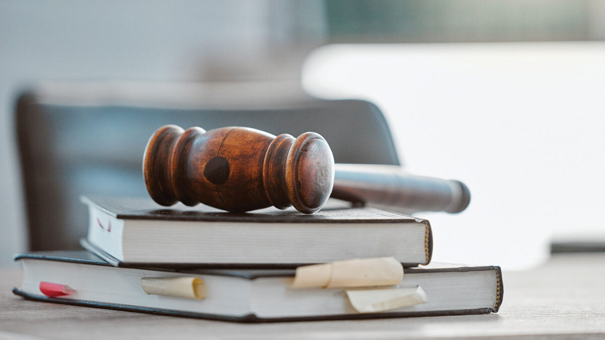 Gavel on top of books