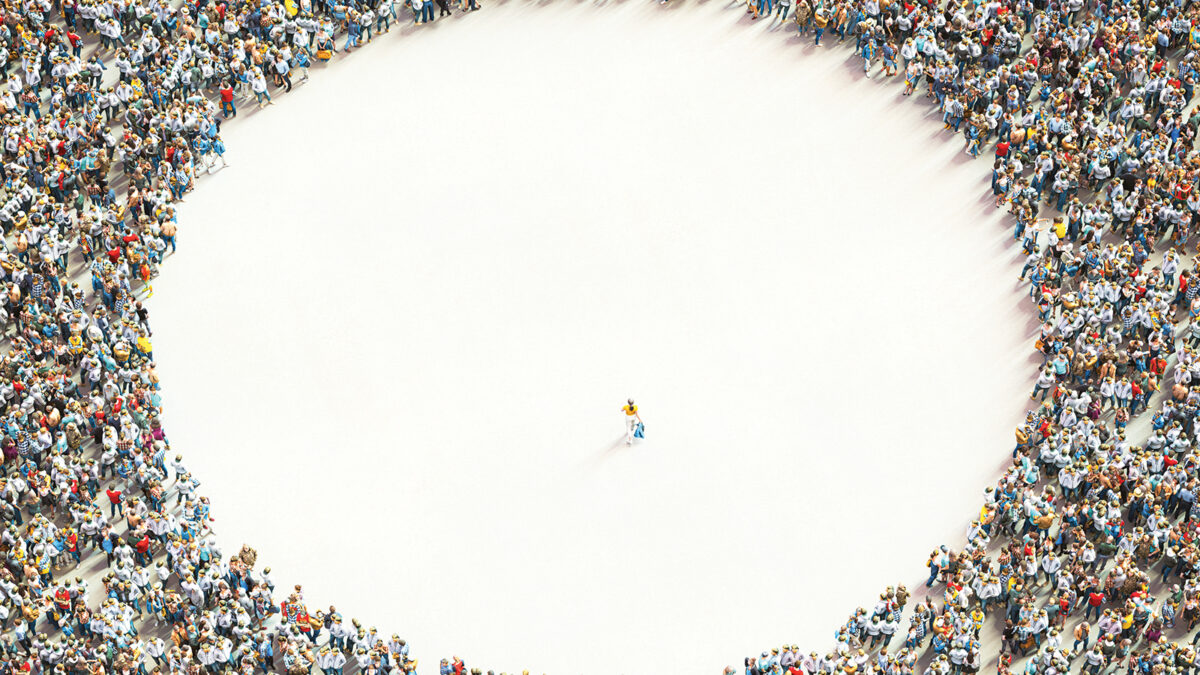 Large group of people with individual standing out