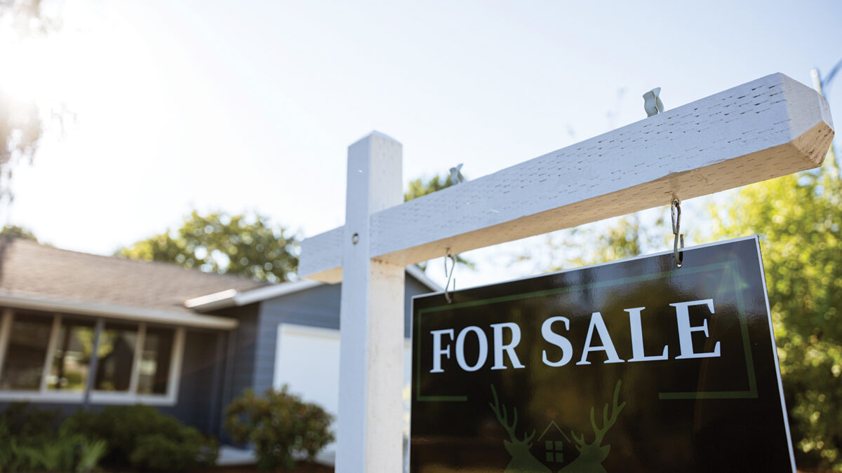 House for Sale Sign in Front Yard