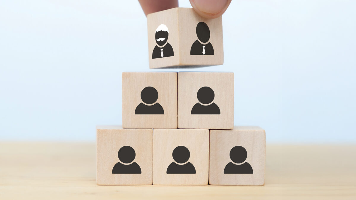 Business hand man put arranging on wooden cube block that family or company Succession business concept from old generation to next generation