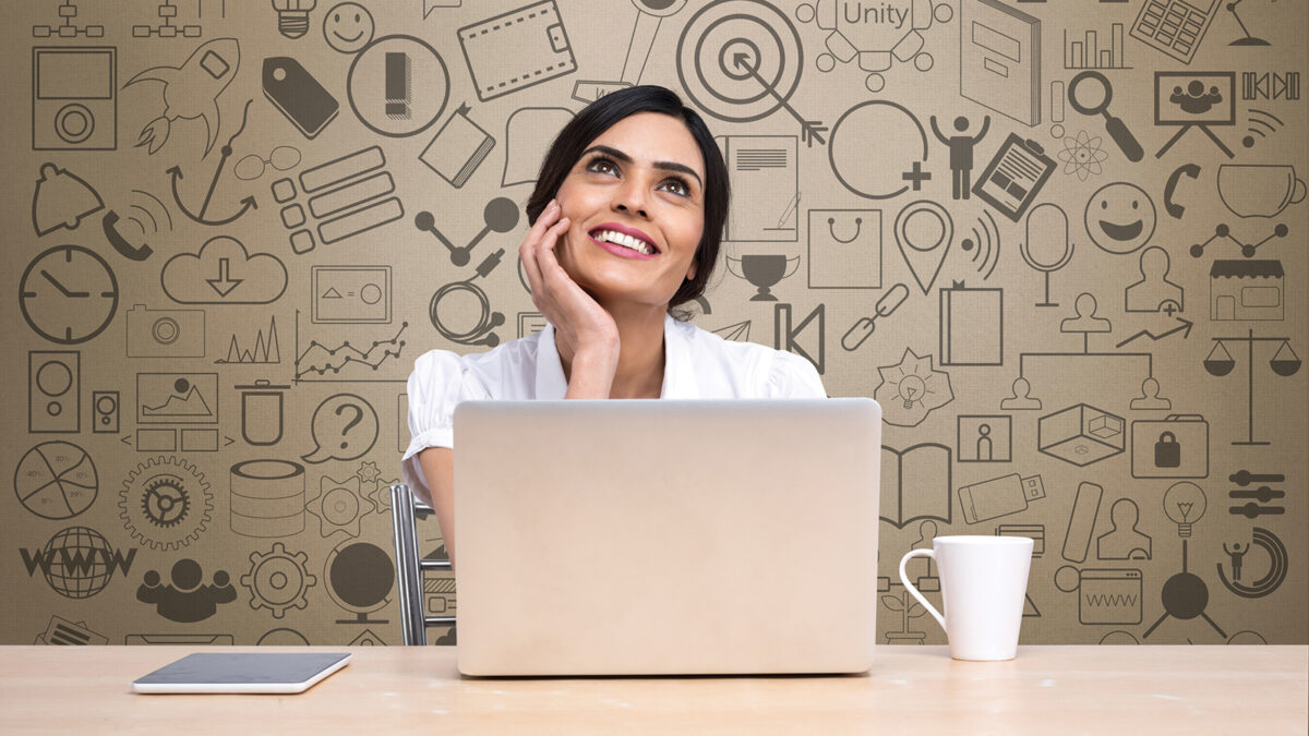 Thoughtful businesswoman with laptop at office desk