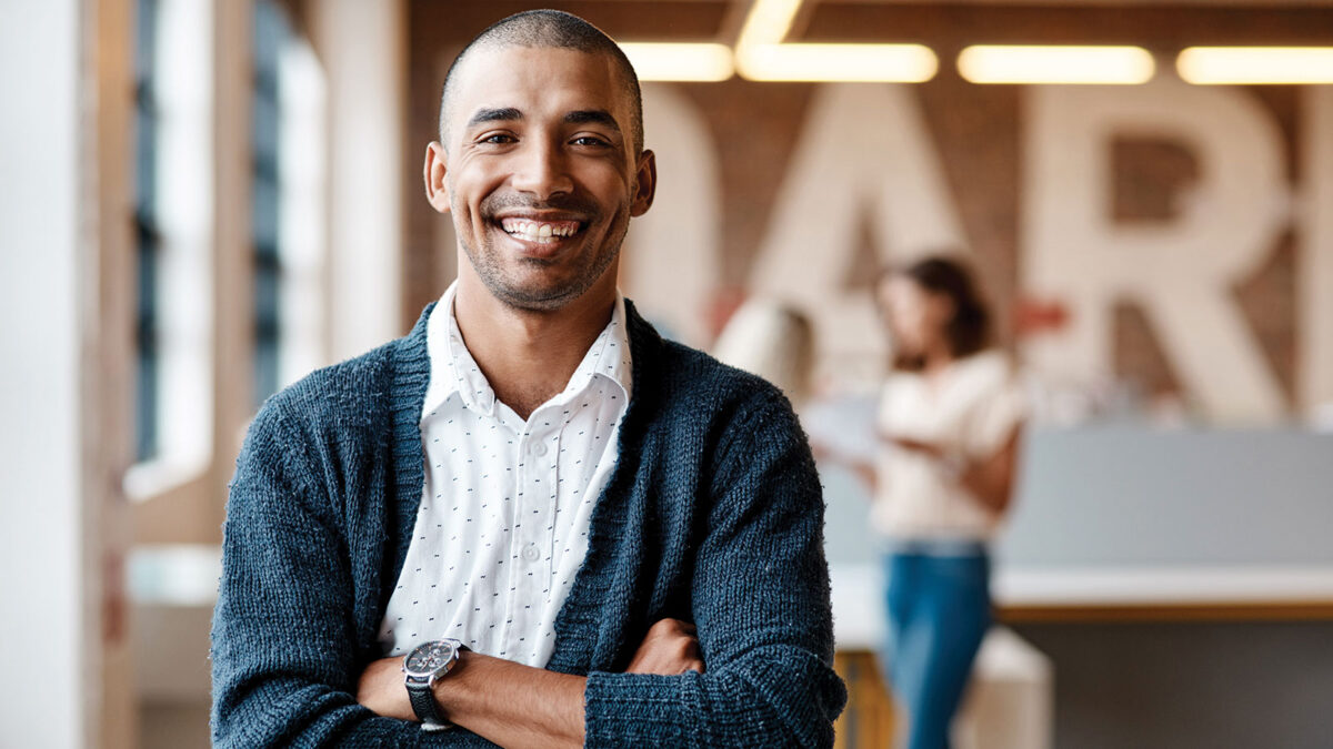 Portrait of a confident young businessman working in a modern office