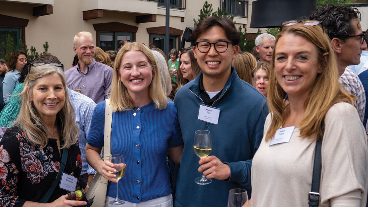 Kimberly Zimmerman, Veronica Phifer, Andrew Hua, and Robin Nolan attend the wine reception at the 2025 Real Estate Symposium.
