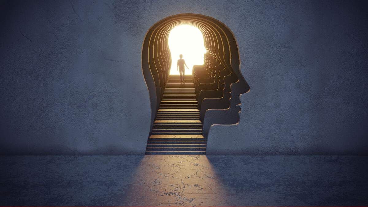 Woman standing in the gate shaped of human head